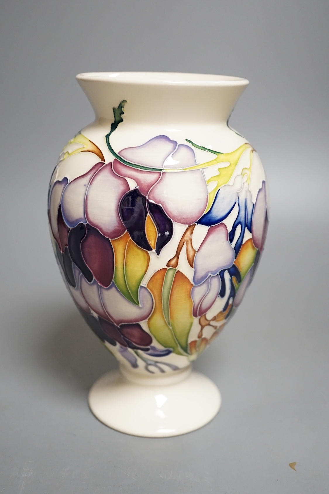A Moorcroft 'purple wisteria' vase, 2013, 17.5 cms high.